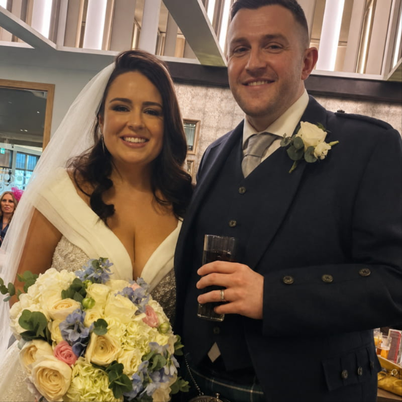 Bride with wedding flowers by Moody Cows Florist