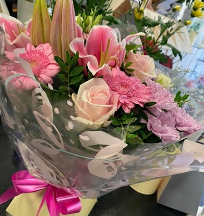 Rose & Lily Handtied - A classical rose and lily and complimentry flowers handtied, placed in water and presented in a gift box. This flower gift is perfect for all occasions. Hand delivered in Carluke by Moody Cows Florist.