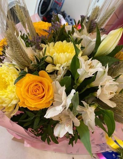 Golden Meadow - A cheerful country-style bouquet in sunny yellow and soft white tones with a relaxed, natural feel.