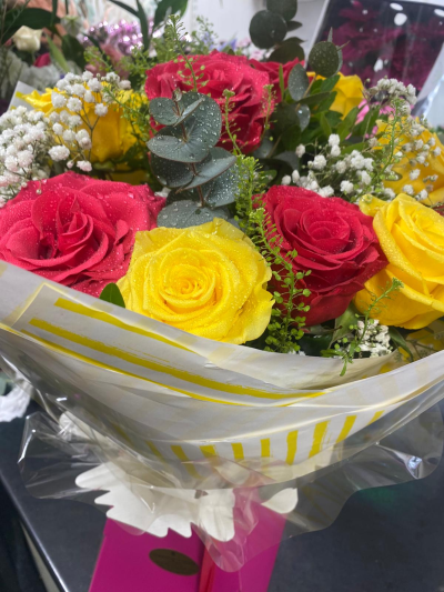 Sunshine & Love - A vibrant bouquet bursting with bold red and yellow tones, perfect for brightening someone's day.
