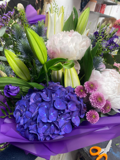 Purple Passion - A striking luxury bouquet combining rich purple, soft pink and fresh green tones.